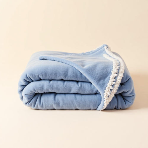 Cloud Plush Blanket folded in soft periwinkle blue